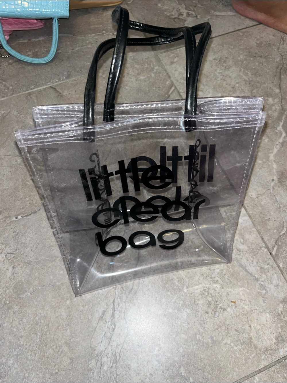Clear Tote Bag with Black Handles and Black Text